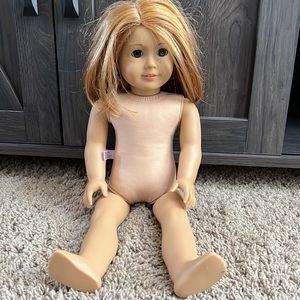 Authentic American Girl doll. Reddish hair with green eyes and freckles.